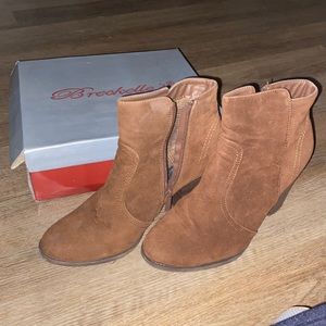 High heeled boots. Great for dress up or casual wear. Size 11.